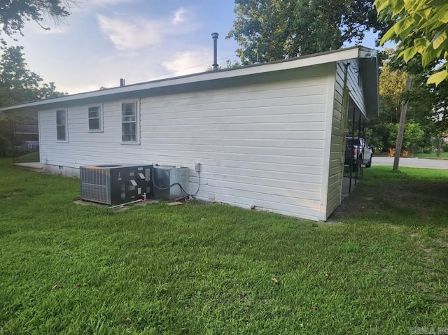 104 W Searcy, Searcy, AR 72082 - back of house featuring central air condition unit, a yard, and crawl space