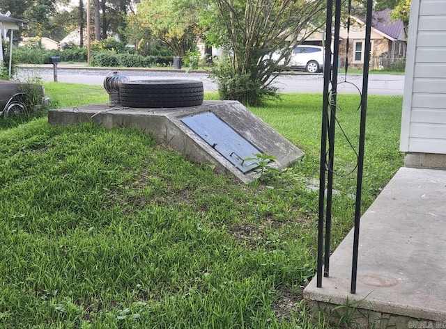104 W Searcy, Searcy, AR 72082 - view of storm shelter featuring a lawn