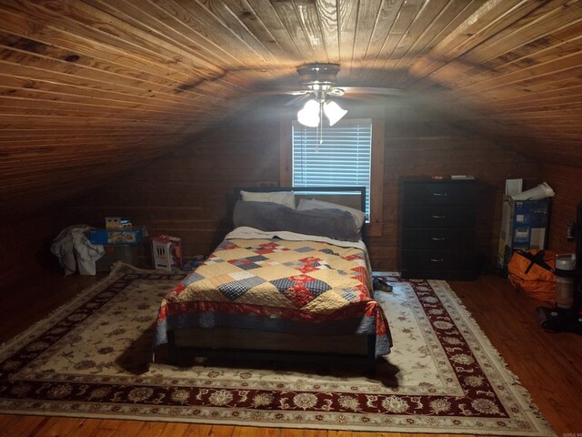 bedroom with vaulted ceiling, wood finished floors, wood ceiling, and a ceiling fan