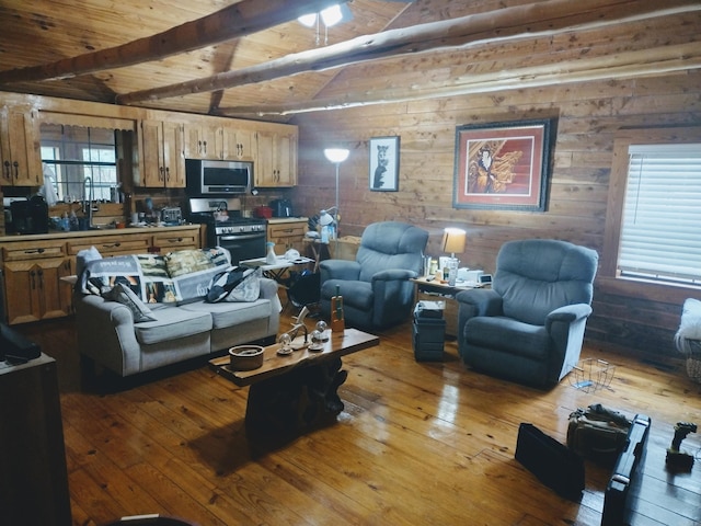 living area with hardwood / wood-style flooring, wood walls, and wooden ceiling