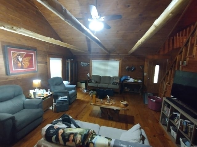 living area featuring wood finished floors, lofted ceiling, wooden walls, ceiling fan, and wooden ceiling