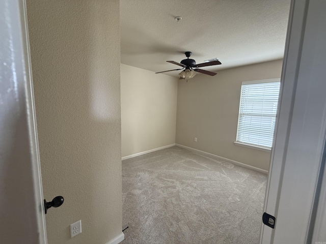 1710 Sweetspire, Conway, AR 72032 - carpeted spare room featuring a ceiling fan, baseboards, fire sprinkler in ceiling, and a textured ceiling