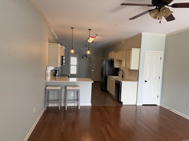 1710 Sweetspire, Conway, AR 72032 - kitchen with black appliances, light countertops, crown molding, baseboards, and a kitchen breakfast bar
