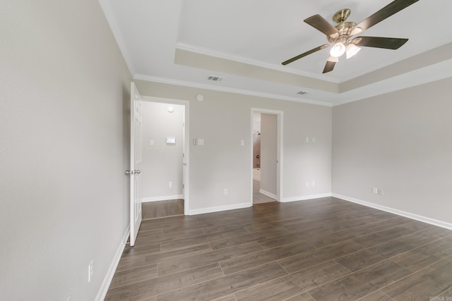 14 Woodbridge, Cabot, AR 72023 - unfurnished room with a tray ceiling, ceiling fan, dark wood-style flooring, and crown molding