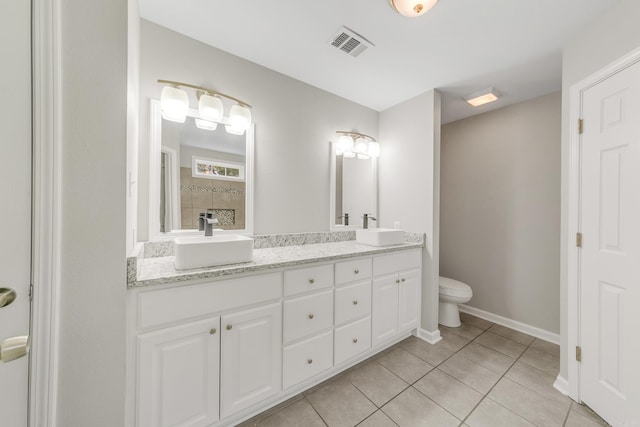 14 Woodbridge, Cabot, AR 72023 - bathroom with tile patterned flooring, toilet, double vanity, and baseboards