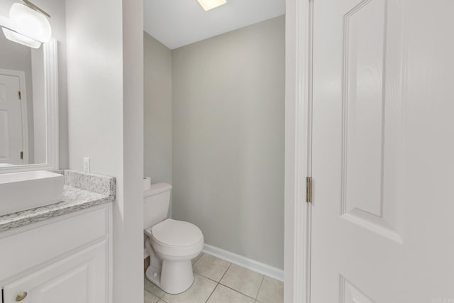 14 Woodbridge, Cabot, AR 72023 - half bathroom featuring tile patterned floors, vanity, toilet, and baseboards