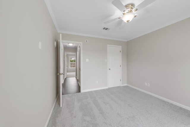 14 Woodbridge, Cabot, AR 72023 - unfurnished bedroom featuring crown molding, baseboards, carpet, and a ceiling fan