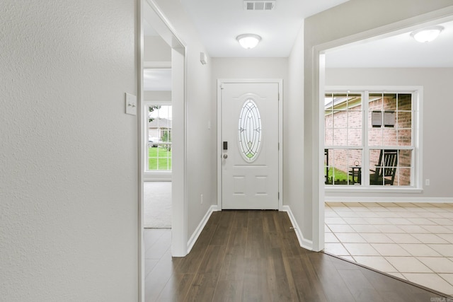 14 Woodbridge, Cabot, AR 72023 - foyer entrance with dark wood-type flooring and baseboards