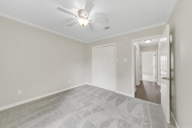 14 Woodbridge, Cabot, AR 72023 - unfurnished bedroom with ornamental molding, carpet floors, baseboards, a closet, and a ceiling fan