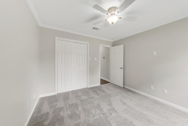 14 Woodbridge, Cabot, AR 72023 - unfurnished bedroom featuring crown molding, carpet floors, a closet, baseboards, and a ceiling fan