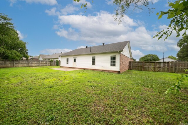14 Woodbridge, Cabot, AR 72023 - back of property with a patio and brick siding