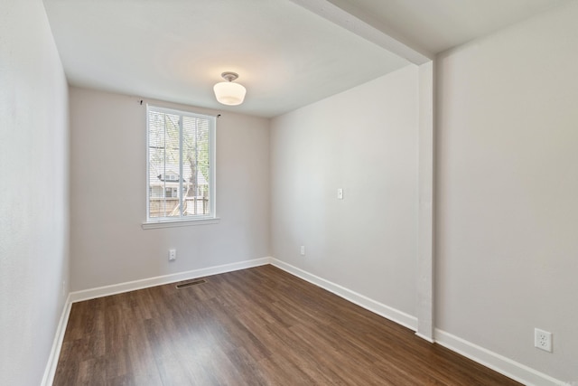 1403 Scott, Conway, AR 72032 - spare room with dark wood-style floors and baseboards