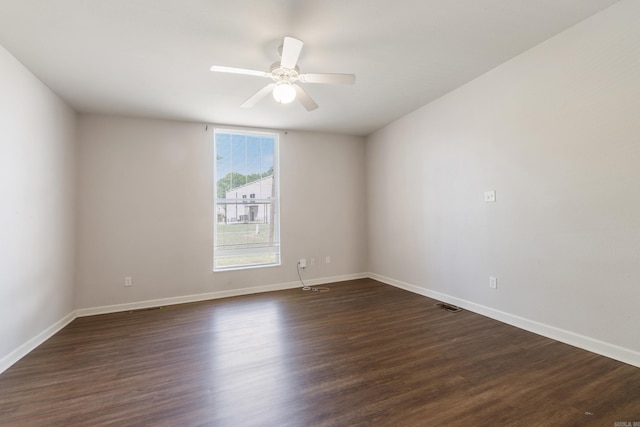1403 Scott, Conway, AR 72032 - empty room featuring baseboards, a ceiling fan, and dark wood-style flooring