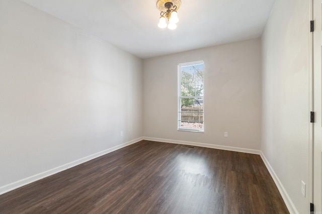 1403 Scott, Conway, AR 72032 - empty room featuring dark wood-style flooring and baseboards