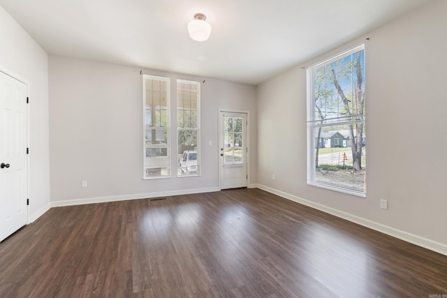 1403 Scott, Conway, AR 72032 - empty room with dark wood-type flooring and baseboards