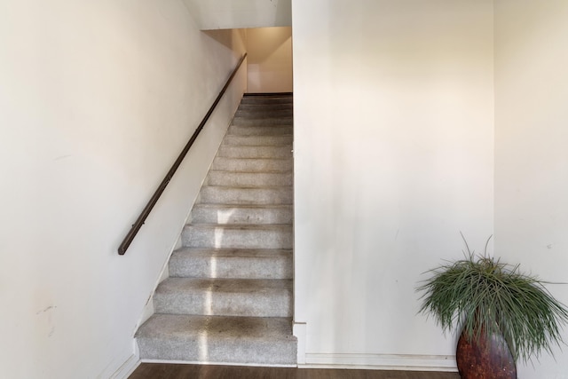 1403 Scott, Conway, AR 72032 - staircase featuring wood finished floors