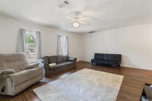 1403 Scott, Conway, AR 72032 - living area featuring dark wood-type flooring, ceiling fan, and baseboards