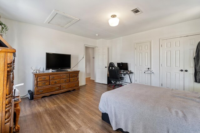 1403 Scott, Conway, AR 72032 - bedroom featuring attic access and wood finished floors