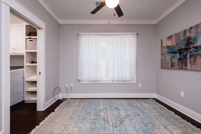 11316 Barrett Rd, Roland, AR 72135 - unfurnished bedroom with dark wood-type flooring, baseboards, washer / dryer, ornamental molding, and a ceiling fan