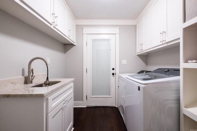 11316 Barrett Rd, Roland, AR 72135 - laundry room with washer and clothes dryer, dark wood finished floors, and cabinet space