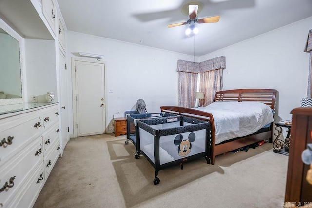 327 N Holloway Ave, El Dorado, AR 71730 - bedroom with light colored carpet, ornamental molding, and a ceiling fan