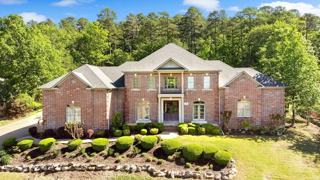 4 Bellegarde Dr, Little Rock, AR 72223 - georgian-style home with brick siding and a front yard