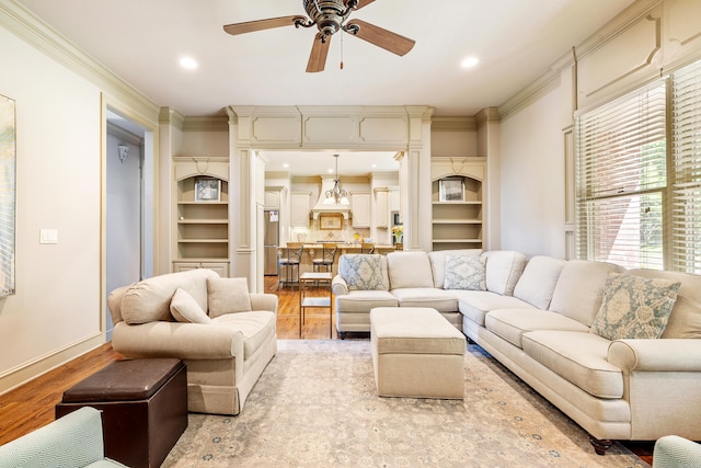 4 Bellegarde Dr, Little Rock, AR 72223 - living room with light wood finished floors, a ceiling fan, crown molding, baseboards, and recessed lighting