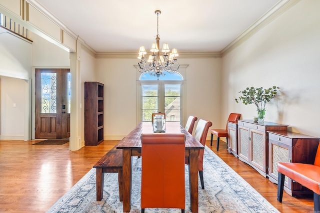 4 Bellegarde Dr, Little Rock, AR 72223 - dining area featuring a chandelier, ornamental molding, and wood finished floors