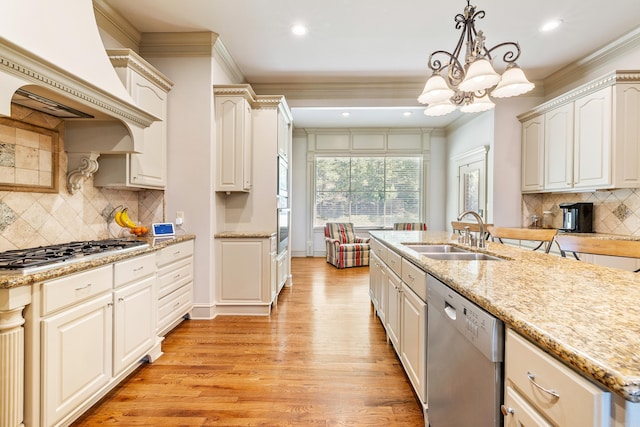 4 Bellegarde Dr, Little Rock, AR 72223 - kitchen featuring appliances with stainless steel finishes, a sink, premium range hood, crown molding, and light wood-type flooring