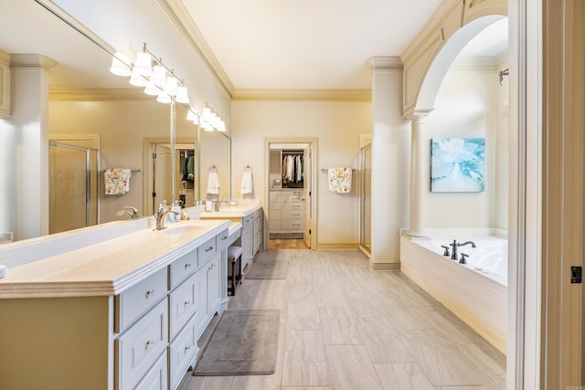 4 Bellegarde Dr, Little Rock, AR 72223 - bathroom featuring vanity, a stall shower, a bath, ornamental molding, and ornate columns