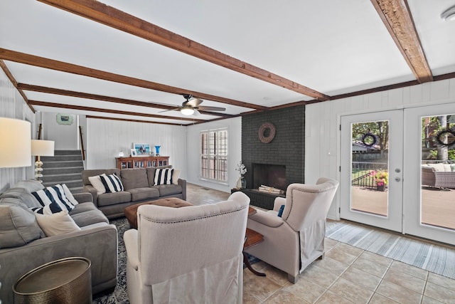 50 Heritage Park Cir, North Little Rock, AR 72116 - living room with beamed ceiling, plenty of natural light, stairway, light tile patterned flooring, and a brick fireplace