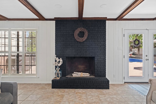 50 Heritage Park Cir, North Little Rock, AR 72116 - living area with beam ceiling, light tile patterned floors, a fireplace, and baseboards