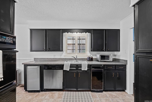 50 Heritage Park Cir, North Little Rock, AR 72116 - kitchen featuring stainless steel dishwasher, dark cabinets, a textured ceiling, a sink, and light tile patterned floors