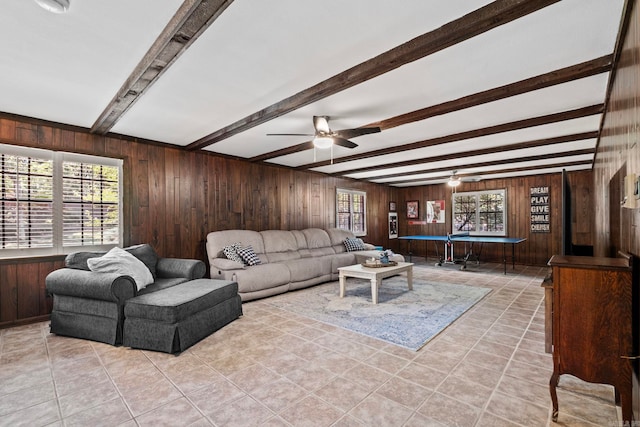 50 Heritage Park Cir, North Little Rock, AR 72116 - living area with wooden walls, ceiling fan, beam ceiling, healthy amount of natural light, and light tile patterned flooring