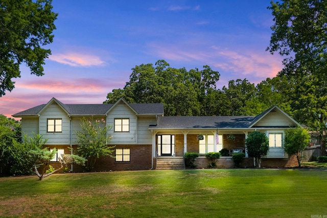 50 Heritage Park Cir, North Little Rock, AR 72116 - split level home featuring brick siding, a porch, and a front yard