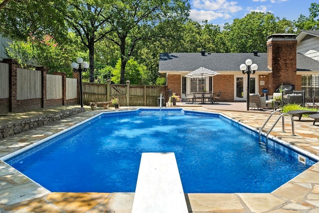 50 Heritage Park Cir, North Little Rock, AR 72116 - view of pool with a fenced backyard, a patio area, and a diving board