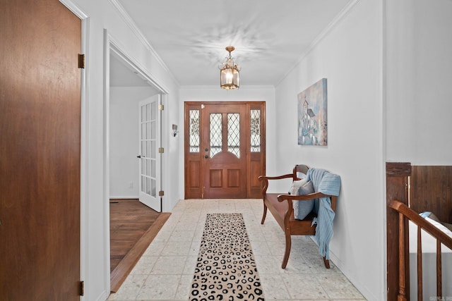 50 Heritage Park Cir, North Little Rock, AR 72116 - entrance foyer with crown molding, baseboards, and a chandelier
