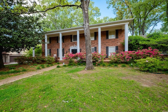 148 Pleasant Valley Dr, Little Rock, AR 72212 - neoclassical home with covered porch, brick siding, and a front lawn