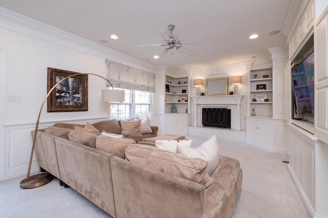 148 Pleasant Valley Dr, Little Rock, AR 72212 - living room featuring light colored carpet, a ceiling fan, crown molding, a fireplace, and a decorative wall