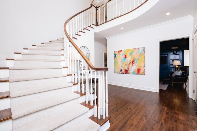 148 Pleasant Valley Dr, Little Rock, AR 72212 - stairs featuring ornamental molding, wood finished floors, baseboards, recessed lighting, and a towering ceiling