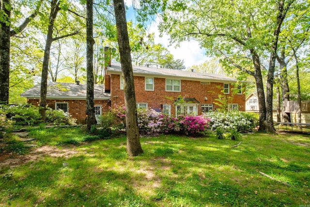 148 Pleasant Valley Dr, Little Rock, AR 72212 - back of house with a chimney and brick siding