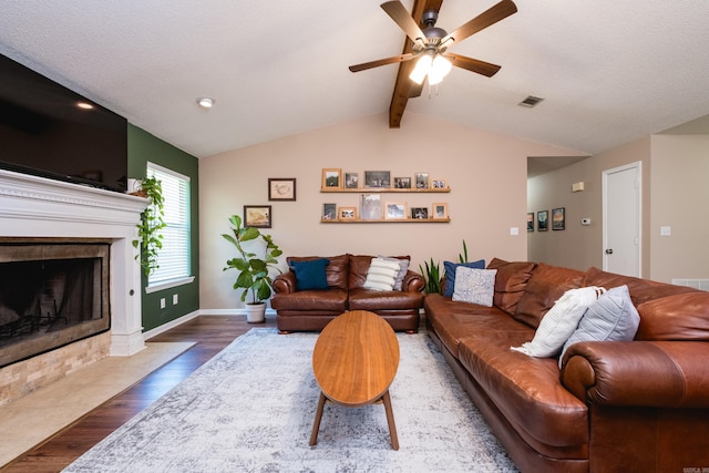 2418 Hickorynut Ct, Little Rock, AR 72211 - living area featuring wood finished floors, ceiling fan, a tile fireplace, and baseboards