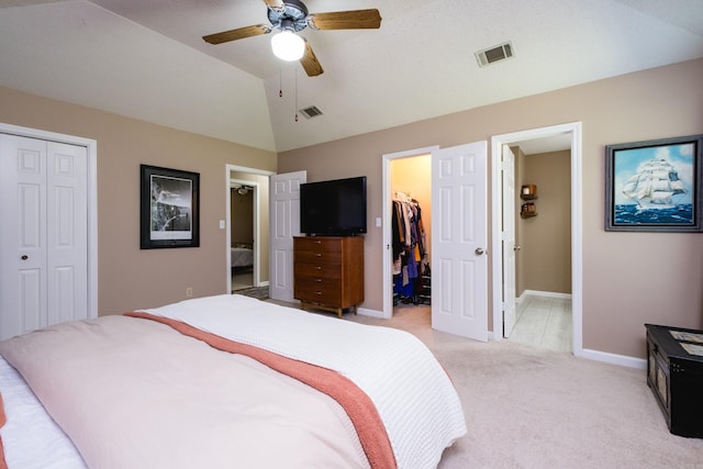 2418 Hickorynut Ct, Little Rock, AR 72211 - bedroom with a closet, light colored carpet, ceiling fan, a walk in closet, and baseboards