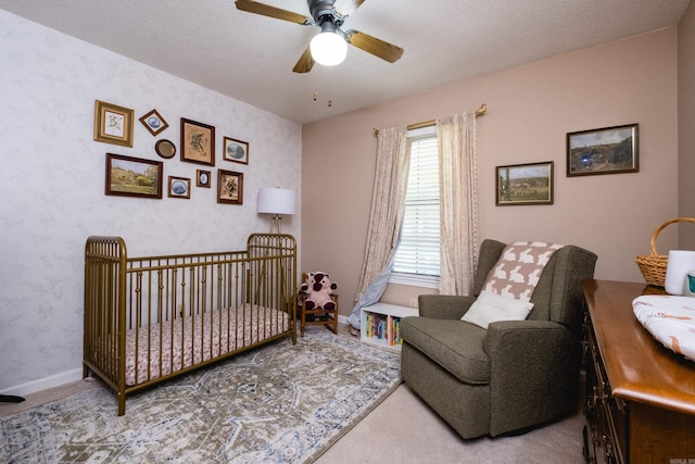 2418 Hickorynut Ct, Little Rock, AR 72211 - bedroom featuring wallpapered walls, carpet floors, baseboards, and a ceiling fan