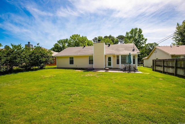2418 Hickorynut Ct, Little Rock, AR 72211 - rear view of property featuring a patio and a chimney