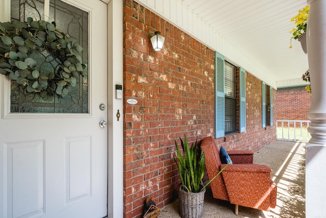 2418 Hickorynut Ct, Little Rock, AR 72211 - entrance to property with covered porch and brick siding
