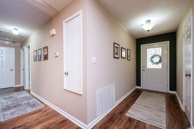 2418 Hickorynut Ct, Little Rock, AR 72211 - foyer entrance featuring a textured ceiling, wood finished floors, and baseboards