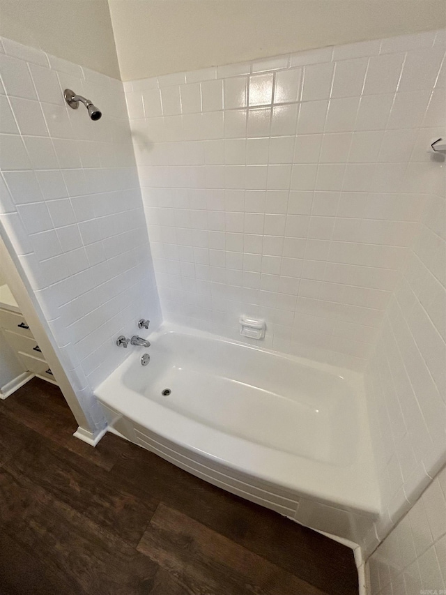 704 W 56th St, North Little Rock, AR 72118 - bathroom featuring wood finished floors and shower / washtub combination