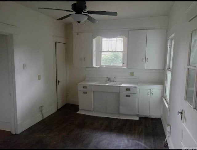 1700 Moss St, North Little Rock, AR 72114 - kitchen with a sink, a ceiling fan, white cabinetry, and light countertops