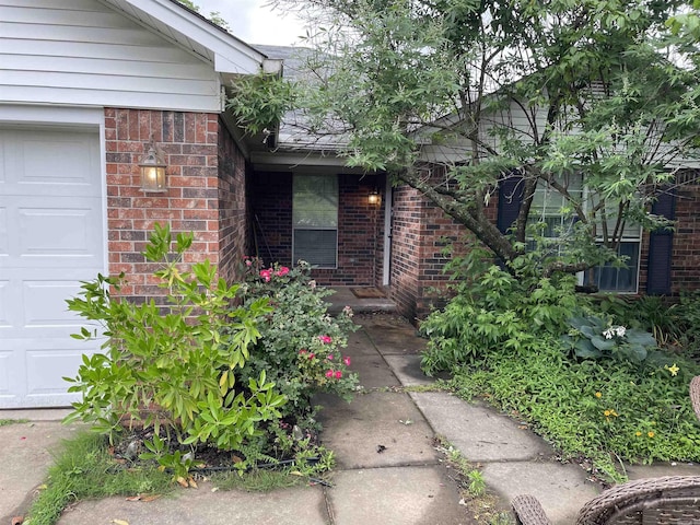131 Sunny Gap, Conway, AR 72032 - view of exterior entry with brick siding and a garage